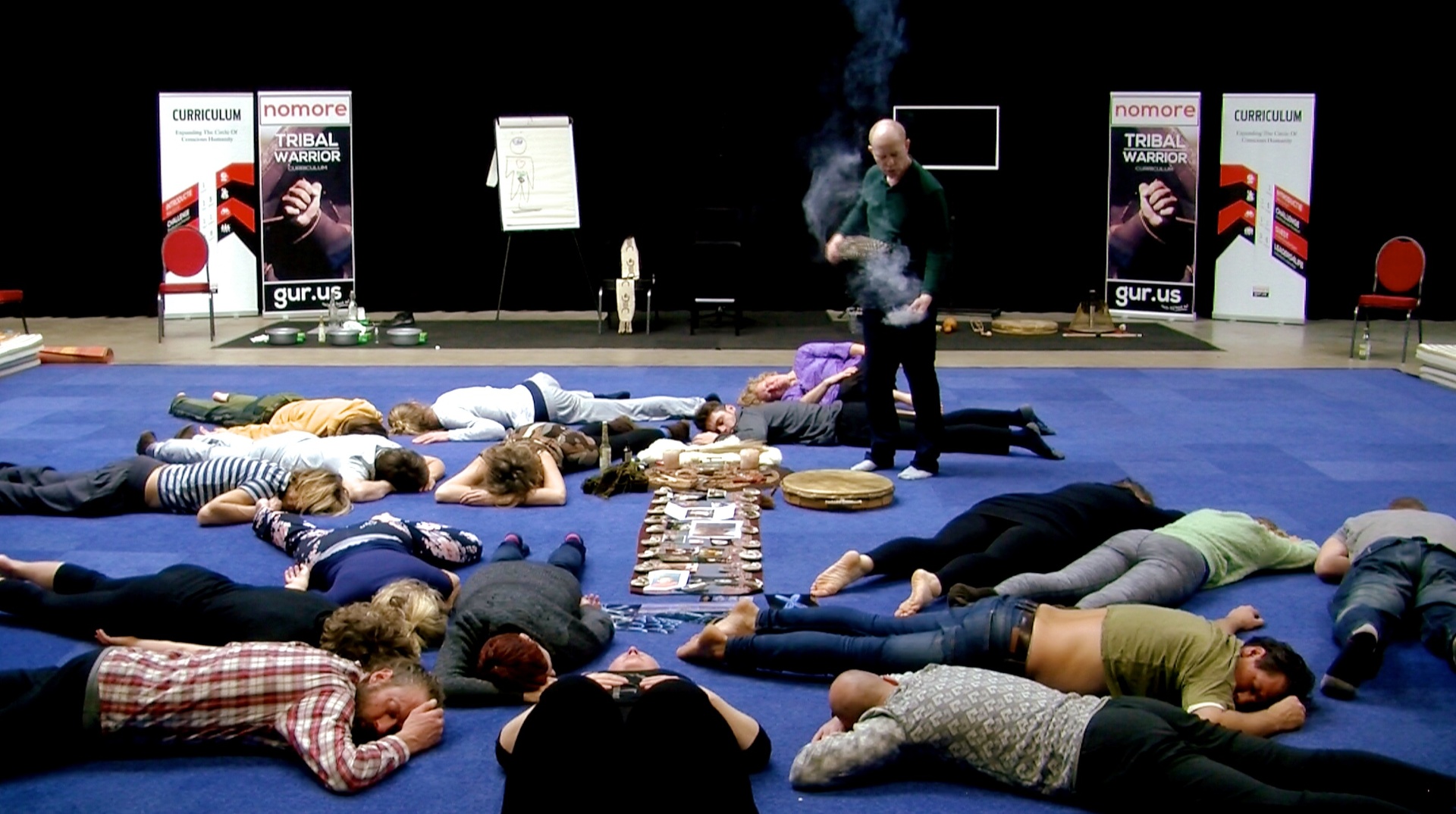 Coen leading a group ceremony with smudge cleansing