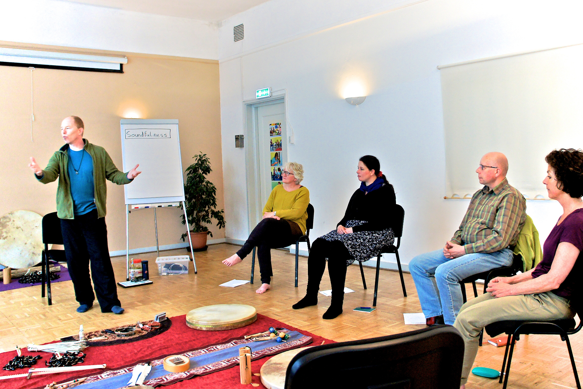 Coen teaching a Soundfulness class in a circle of participants