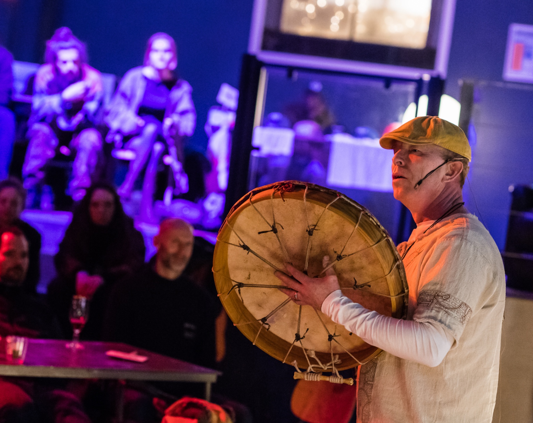 Coen Tuerlings performing with a shamanic drum in a live sound ceremony