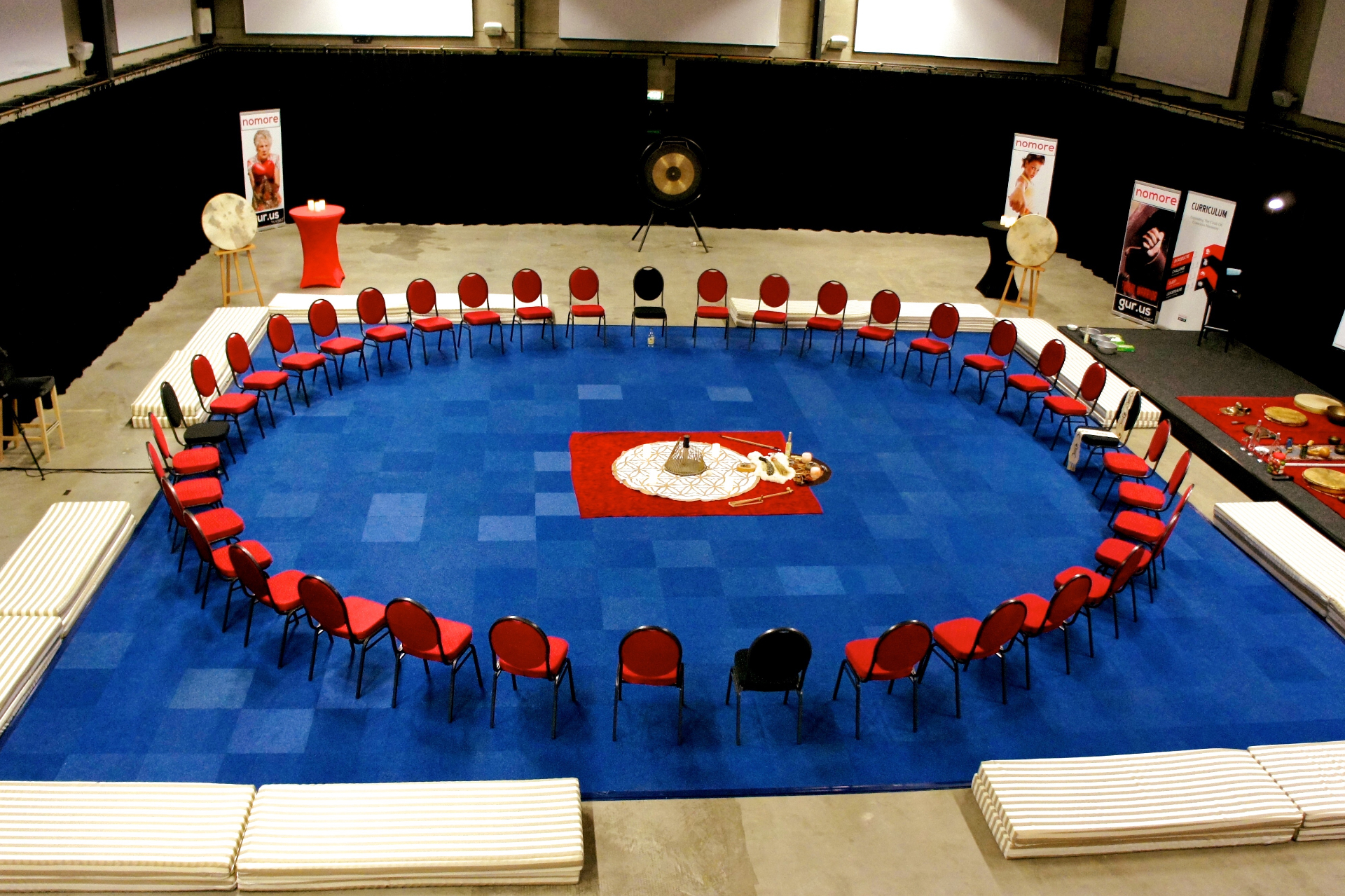 Ceremonial circle setup with gong and chairs