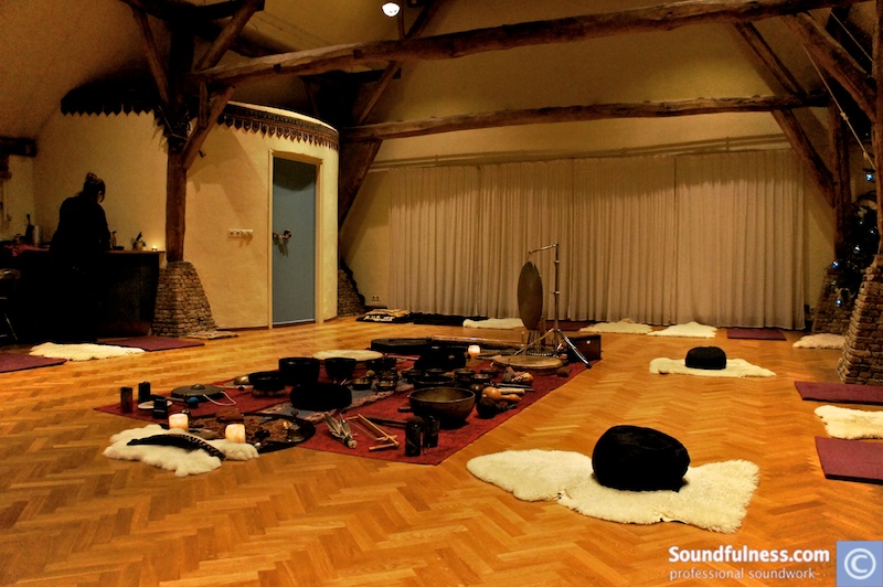 Historic barn loft set with sheepskins, cushions and central instrument altar