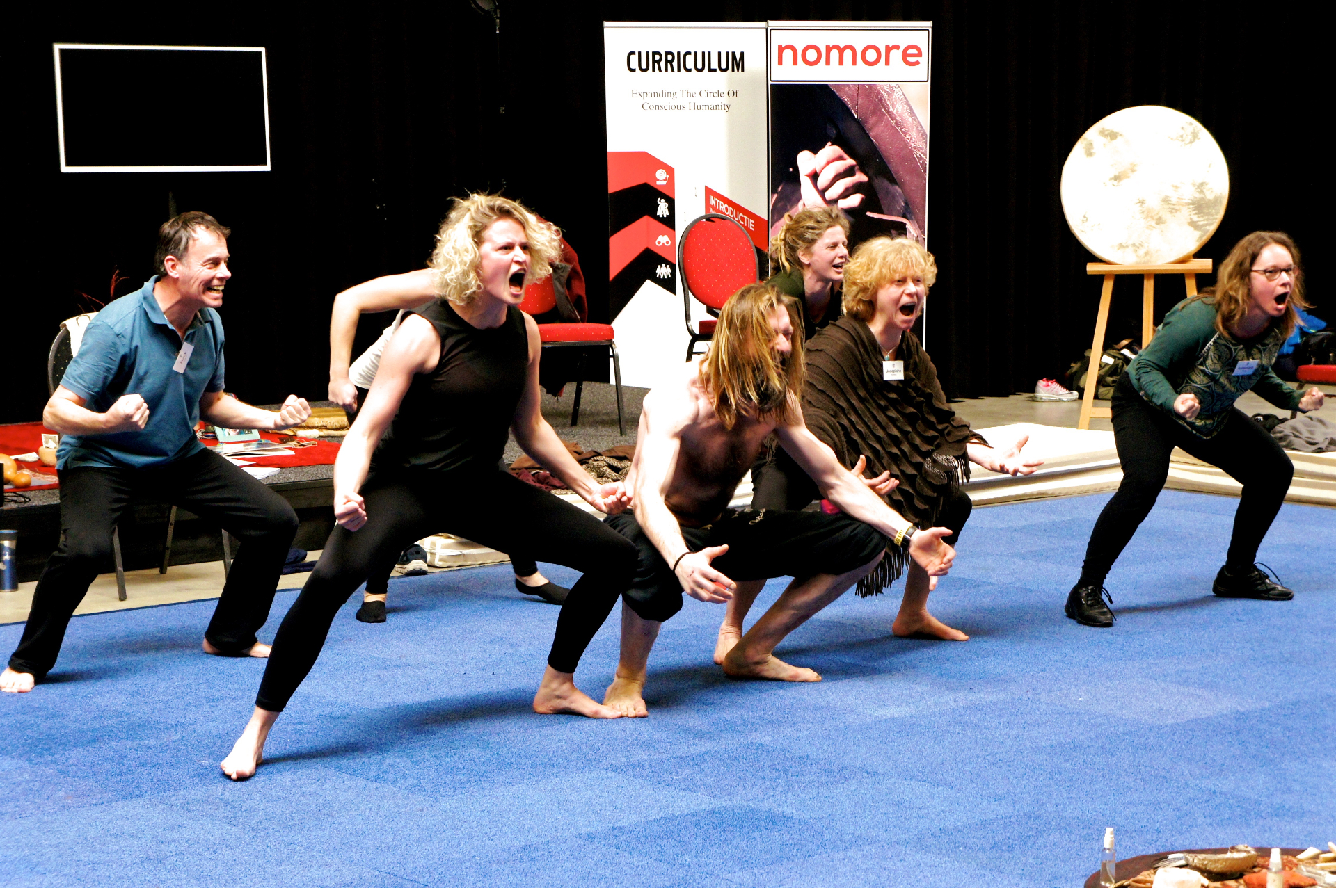 Group performing an embodied warrior exercise