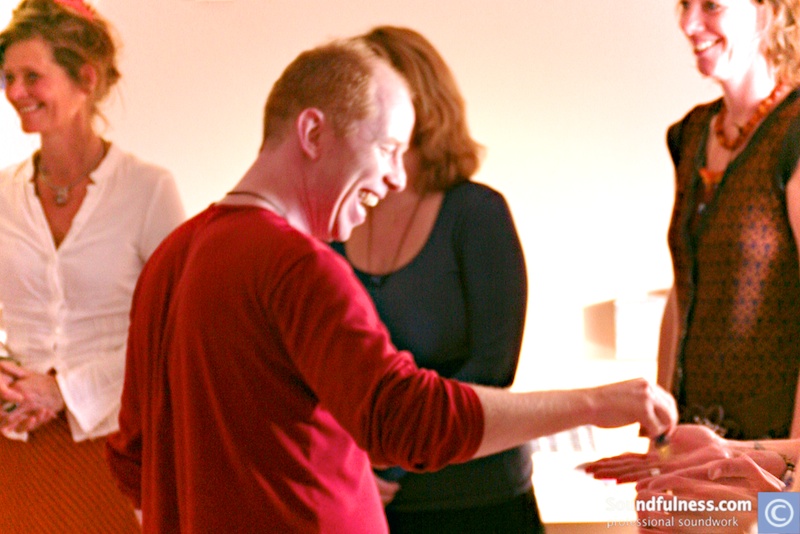 Coen laughing with participants during a shaman voice workshop